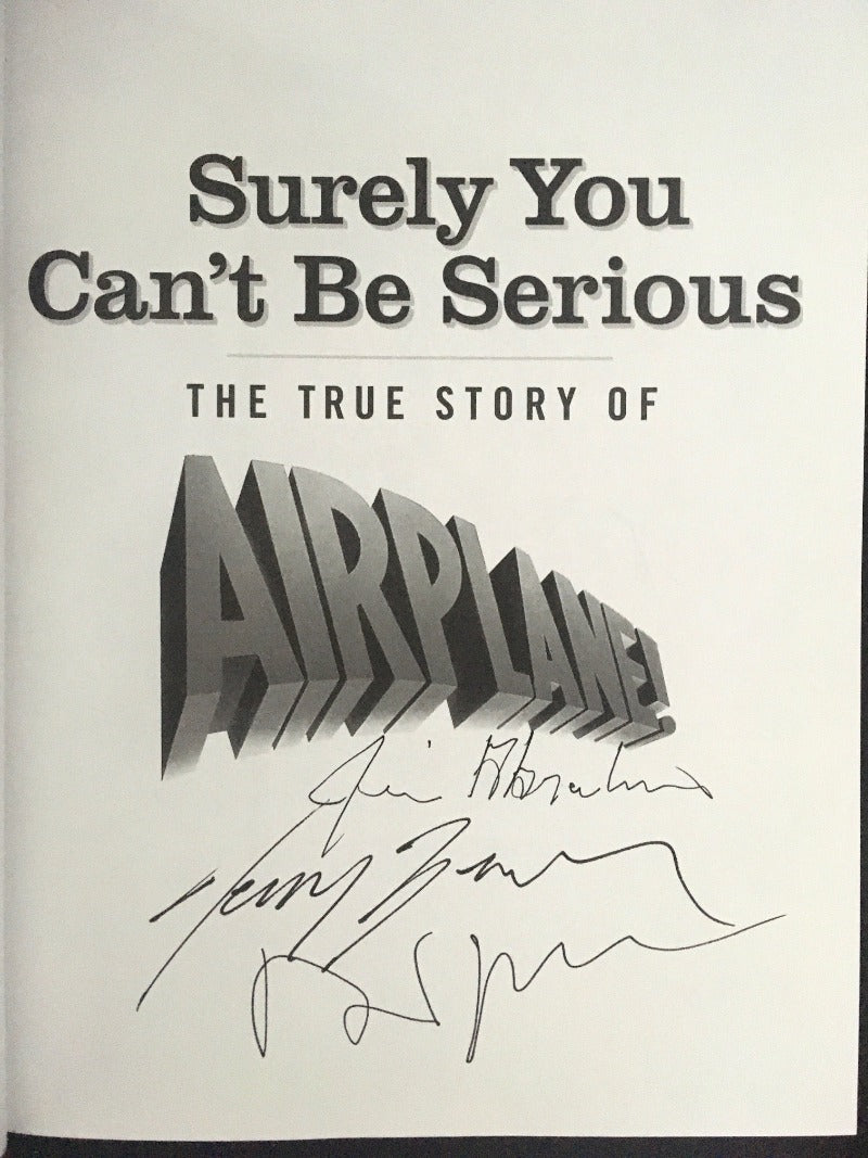 SURELY YOU CAN'T BE SERIOUS. The True Story of Airplane! Signed by David Zucker, Jim Abrahams & Jerry Zucker,