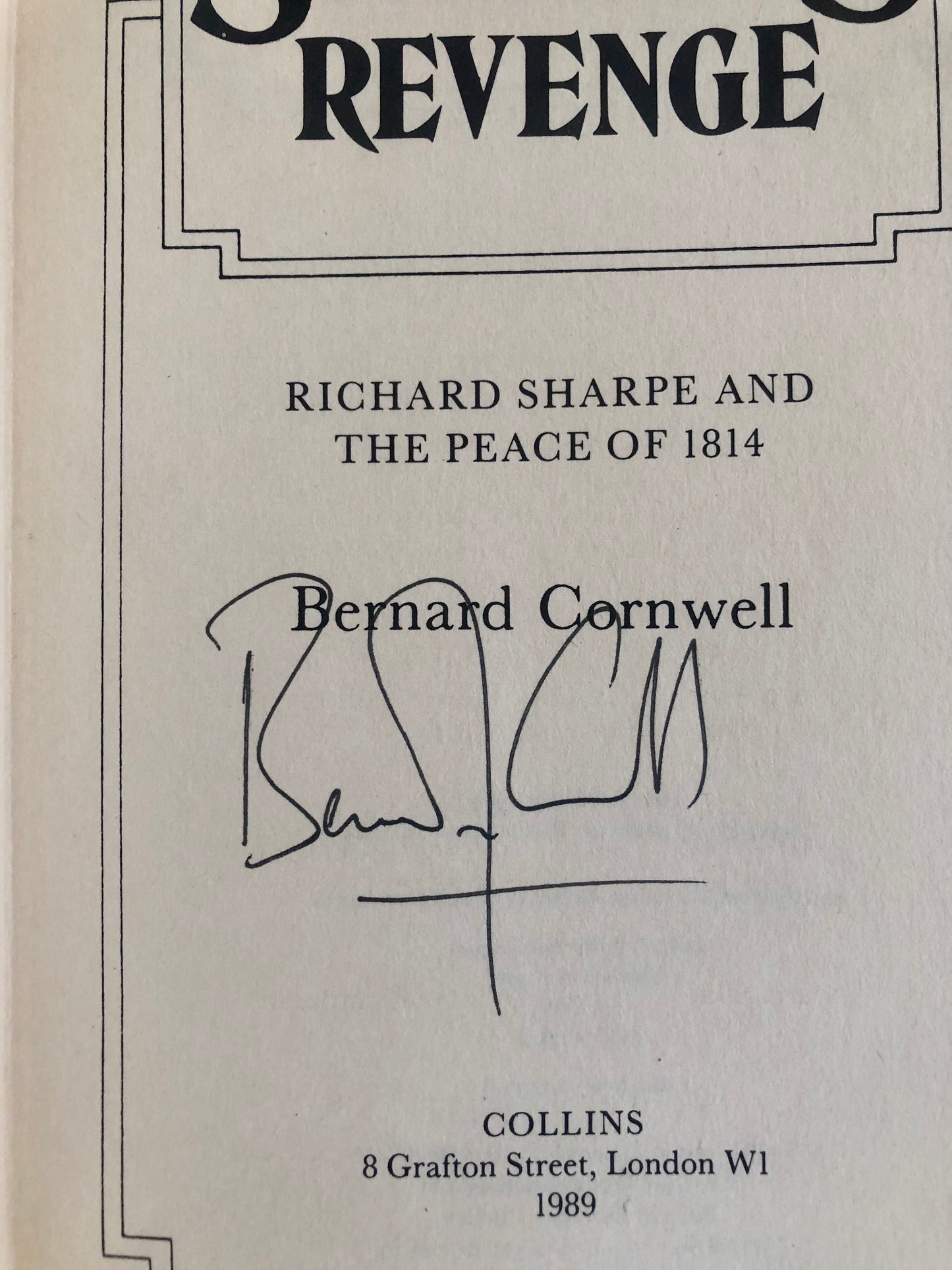 Book cover of 'Revenge: Richard Sharpe and the Peace of 1814' by Bernard Cornwell with signature and publication details.